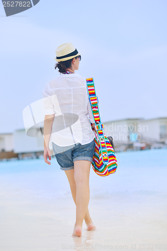 Image of beautiful woman on beach have fun and relax