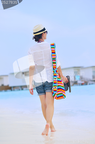 Image of beautiful woman on beach have fun and relax