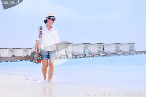 Image of beautiful woman on beach have fun and relax