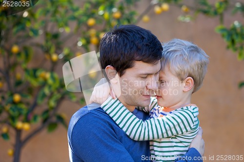 Image of family hugging