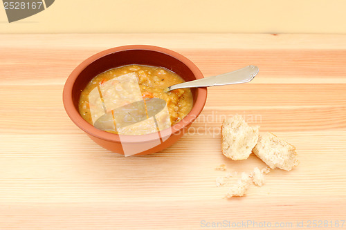 Image of Vegetable soup with remainder of bread roll