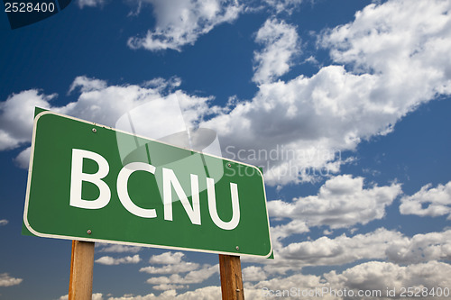 Image of BCNU Green Road Sign Over Sky