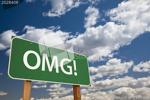 Image of OMG! Green Road Sign Over Sky