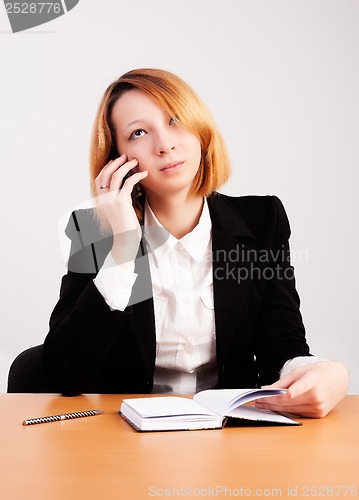 Image of beautiful business woman calling
