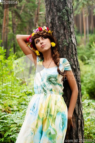 Image of Attractive woman with flower wreath