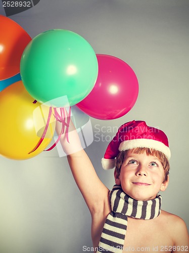 Image of boy in Santa Claus hat