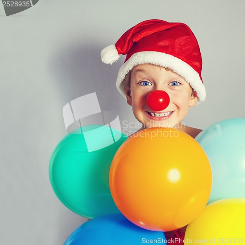 Image of boy in Santa Claus hat