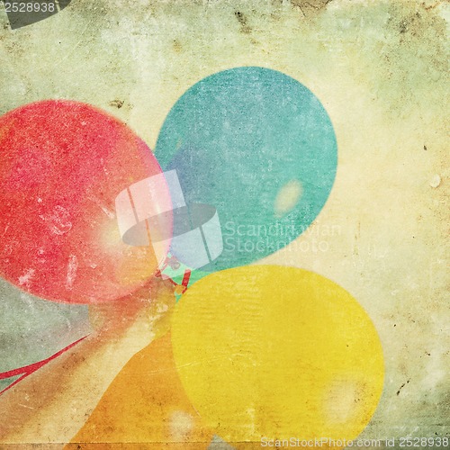 Image of paper texture with multicolored balloons