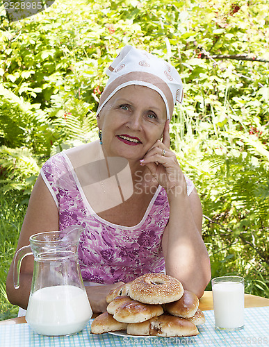 Image of Appetizing homemade pies with fresh milk from a caring housewife