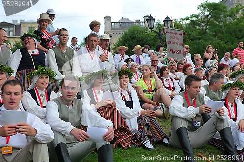 Image of RIGA, LATVIA - JULY 06: People in national costumes at the Latvi