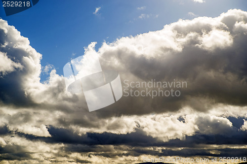 Image of Blue sky with layers of clouds
