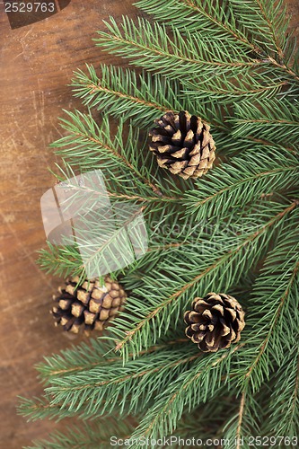 Image of frame from branch of Christmas tree on old wood