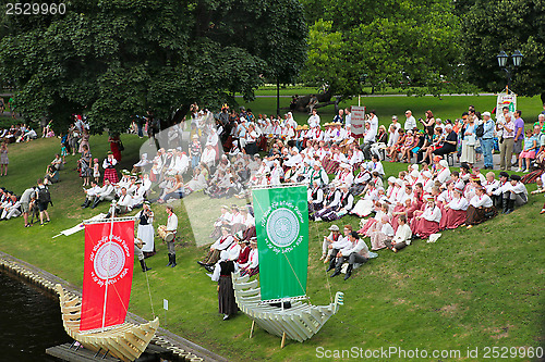 Image of RIGA, LATVIA - JULY 06: People in national costumes at the Latvi