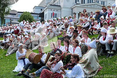 Image of RIGA, LATVIA - JULY 06: People in national costumes at the Latvi