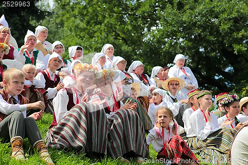 Image of RIGA, LATVIA - JULY 06: People in national costumes at the Latvi