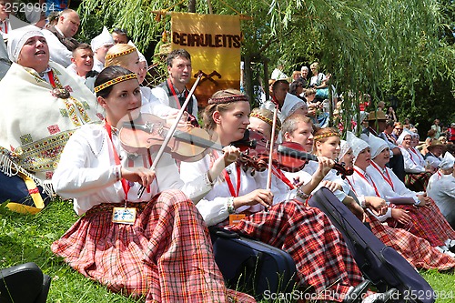 Image of RIGA, LATVIA - JULY 06: People in national costumes at the Latvi