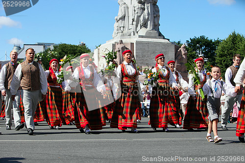 Image of RIGA, LATVIA - JULY 06: People in national costumes at the Latvi