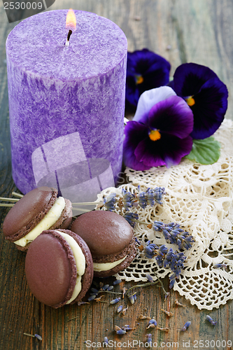 Image of Macarons, sprigs of lavender and viols.