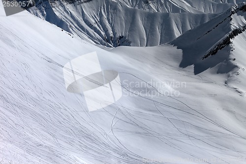 Image of View on snowy off piste slope with trace from ski, snowboards an