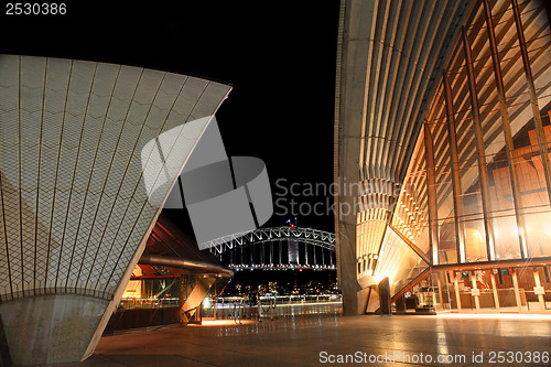 Image of Sydney Opera House and Harbour Bridge lit at night