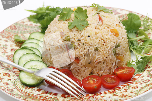 Image of Tomato biryani and fork