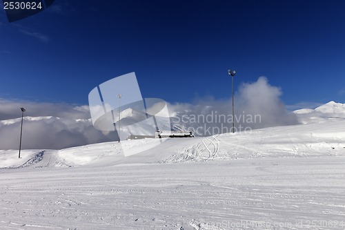 Image of Ski slope and hotel in winter mountains