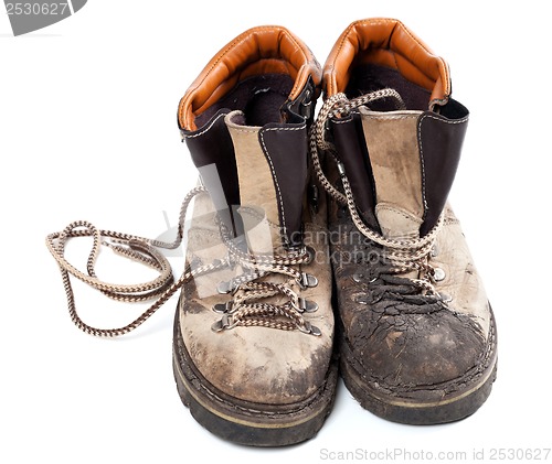 Image of Pair of old dirty trekking boots