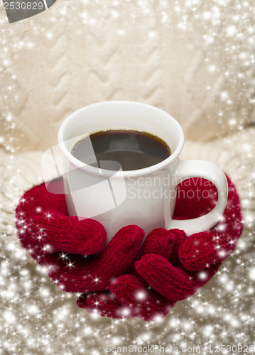 Image of Woman in Sweater with Red Mittens Holding Cup of Coffee