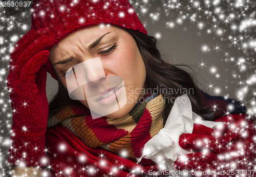 Image of Sick Woman with Tissue and Snow Effect Surrounding