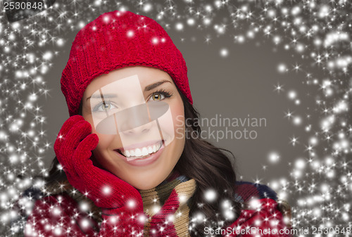 Image of Smilng Woman Wearing Winter Hat and Gloves with Snow Effect