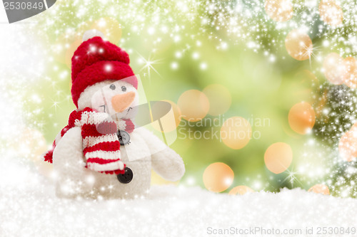 Image of Cute Snowman Over Abstract Snow and Light Background