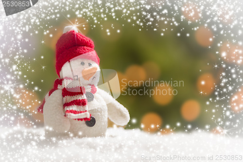 Image of Cute Snowman Over Abstract Snow and Light Background