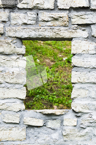 Image of Window aperture in a wall from calcareous stones, a close up