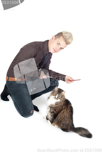 Image of Portrait of handsome man with cat