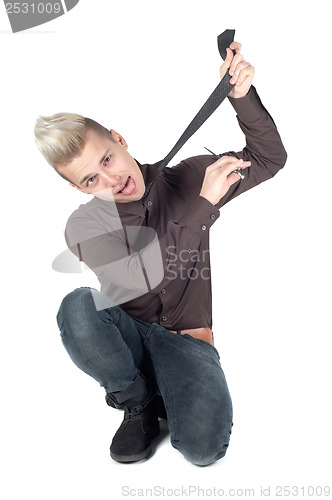 Image of Man cuts off his tie