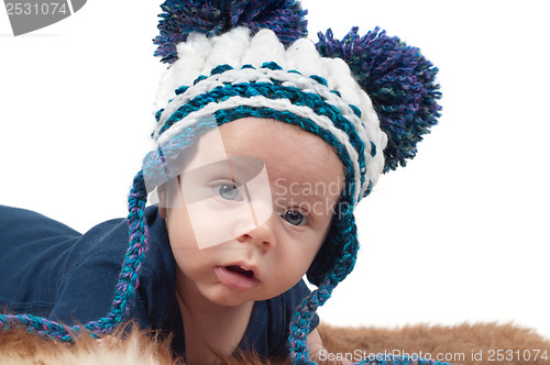 Image of Little baby in cute knitted hat