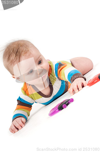 Image of Little baby striped body lying on his tummy