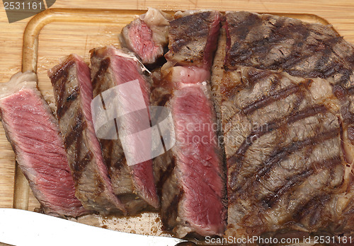 Image of Wagyu steak cut on board