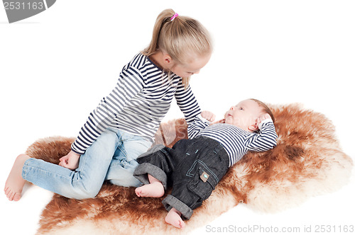 Image of Newborn baby with sister
