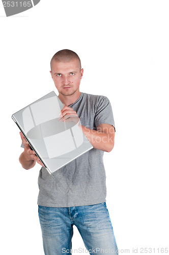 Image of Man holding a laptop on his hands