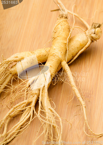 Image of Fresh Ginseng on the wooden background