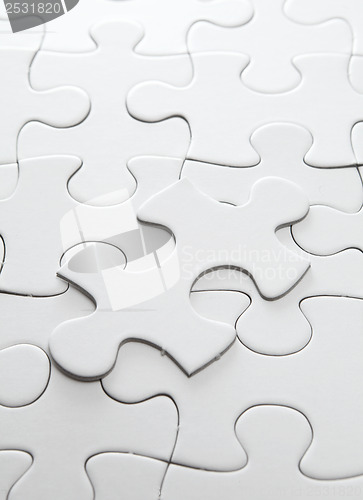 Image of Incomplete puzzle with missing piece