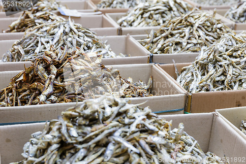 Image of Dried small anchovy fish in the paper box