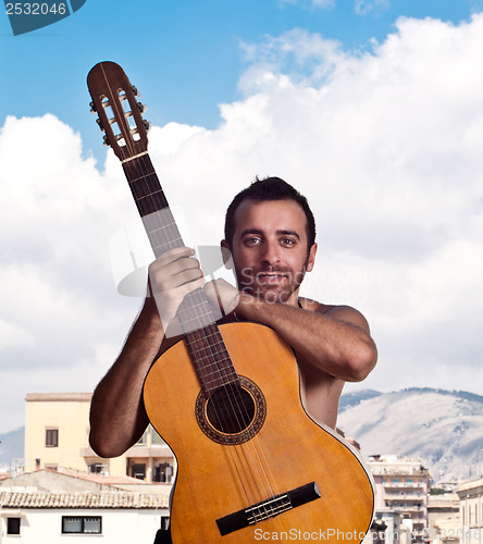 Image of man with a guitar