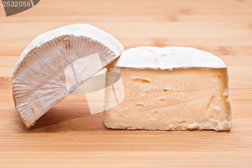 Image of Soft cheese on a wooden board