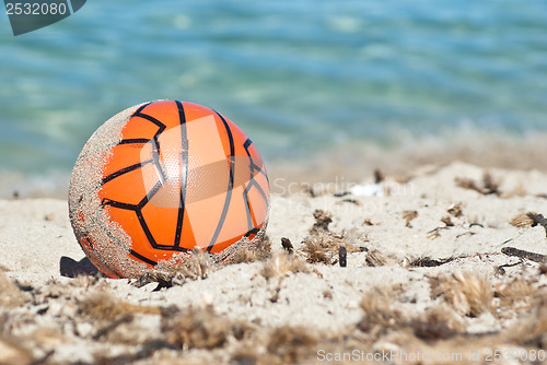 Image of Red ball in the sand
