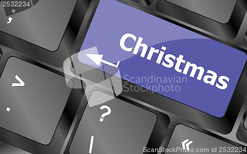 Image of christmas button on the keyboard key - holiday concept