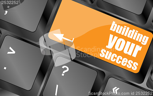 Image of building your success words on button or key showing motivation for job or business