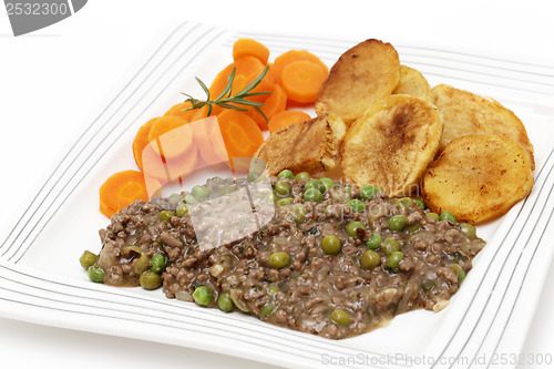 Image of Plate of mince and peas with carrots and potato