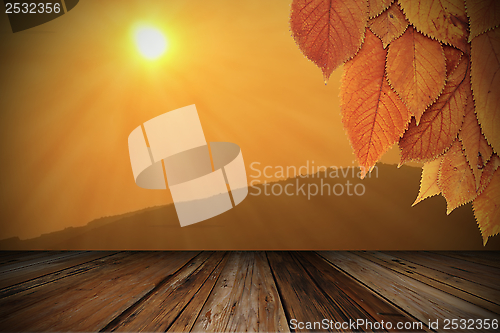 Image of beautiful sunrise viewed from wood veranda